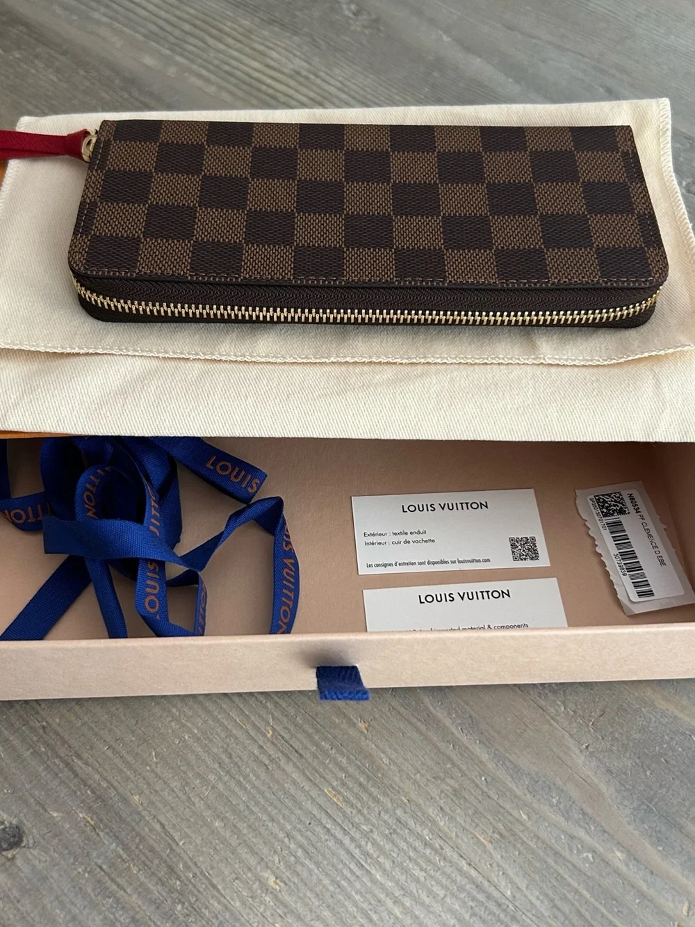 Authentic Louis Vuitton Damier Ebene Zip-Around Wallet with Red Leather Pull